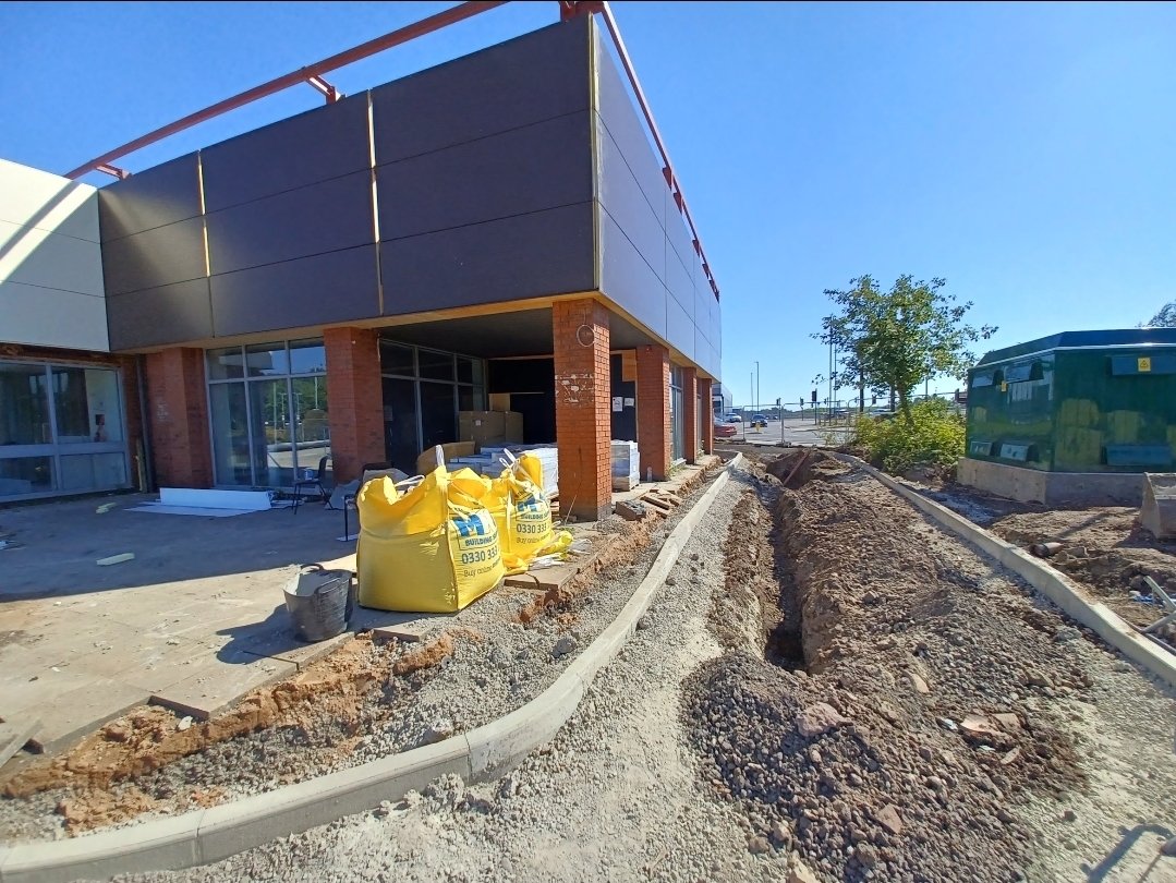 A building exterior with work underway around it.